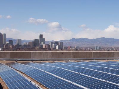 Solar farm with Denver, CO in the background