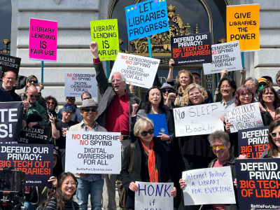 Supporters surround Internet Archive founder Brewster Kahle and San Francisco District 1 Supervisor Connie Chan on the steps of San Francisco City Hall.